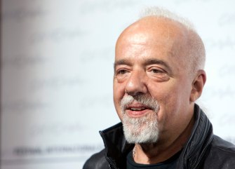** CORRECTS SPELLING OF FIRST NAME TO PAULO ** FILE - In this Oct. 20, 2009 file photo, Brazilian writer Paulo Coelho poses during a photocall for the presentation of the movie "Paulo Coelho's - The Experimental Witch" at the 4th edition of the Rome Film Festival, in Rome. Coelho says his books were banned in Iran. (AP Photo/Andrew Medichini, file)